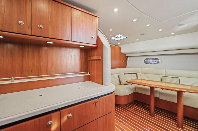 Slide: The Image of Luxurious interior of 2008 Tiara Yachts 4300 Sovran with wood cabinetry and plush seating. - 23
