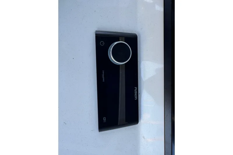 Slide: The Image of Fusion marine audio system on 2025 Intrepid 327 Cuddy boat dashboard. - 30
