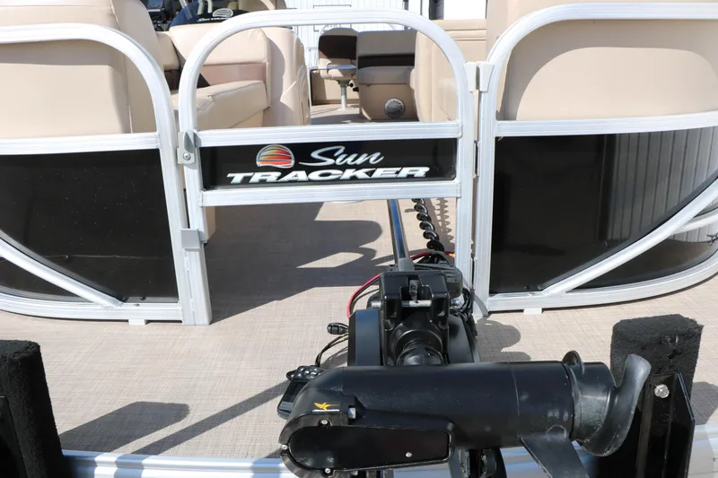 Slide: The Image of 2019 Sun Tracker SportFish 22 XP3 pontoon boat interior with seating and motor. - 15