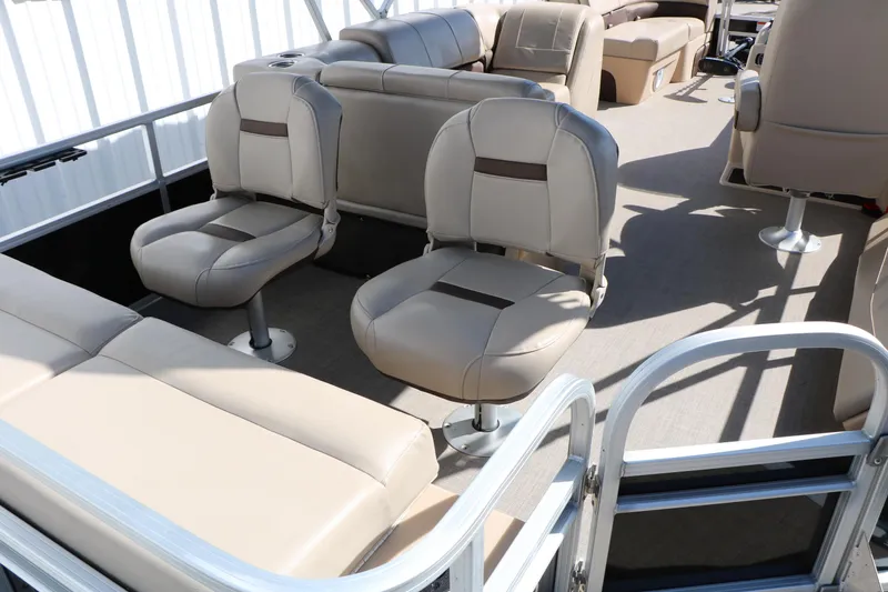 Slide: The Image of 2019 Sun Tracker SportFish 22 XP3 interior with beige seating and spacious layout. - 29