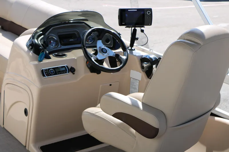 Slide: The Image of 2019 Sun Tracker SportFish 22 XP3 boat helm with steering wheel and navigation system. - 33