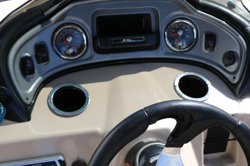 Slide: The Image of Dashboard of 2019 Sun Tracker SportFish 22 XP3 boat with steering wheel and gauges. - 44