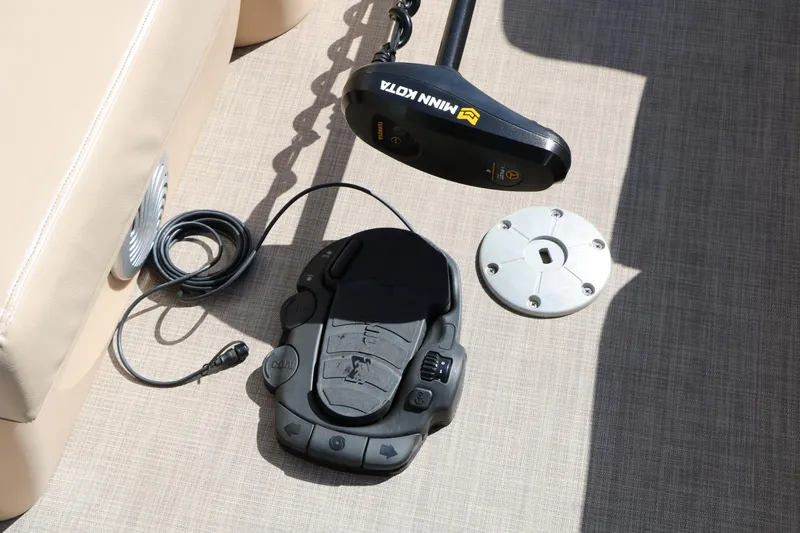 Slide: The Image of Minn Kota trolling motor and foot pedal on 2019 Sun Tracker SportFish 22 XP3 boat. - 49