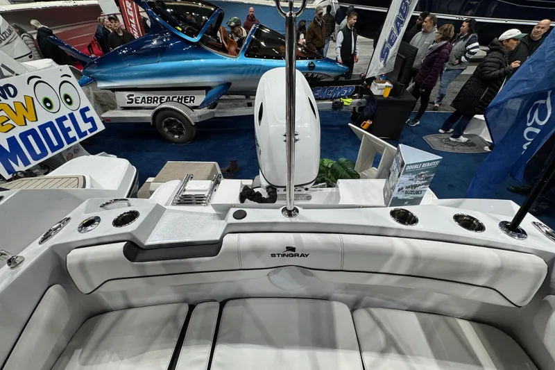 Slide: The Image of 2026 Stingray 172 DC boat interior at a marine exhibition, showcasing sleek design and features. - 14
