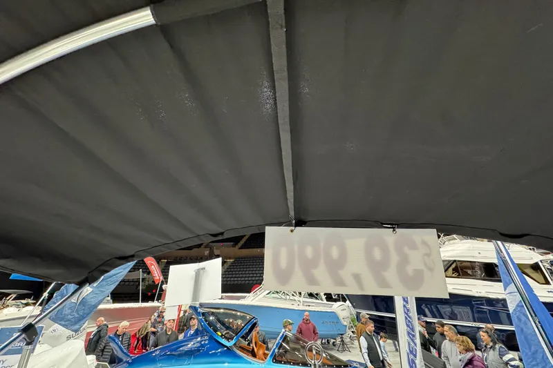 Slide: The Image of Boat show featuring 2026 Stingray 172 DC model with attendees and various boats displayed. - 15