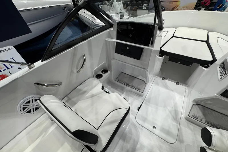 Slide: The Image of Interior of 2026 Stingray 172 DC boat with white seating and modern design. - 18
