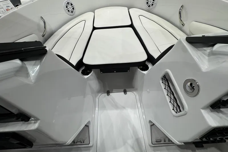 Slide: The Image of 2026 Stingray 172 DC boat interior with white seating and modern design. - 19