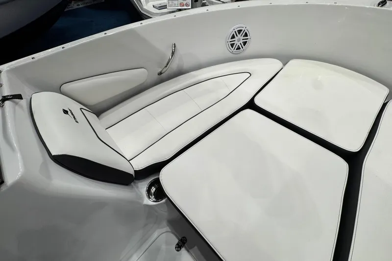 Slide: The Image of Interior seating of 2026 Stingray 172 DC boat, featuring white cushioned seats. - 20