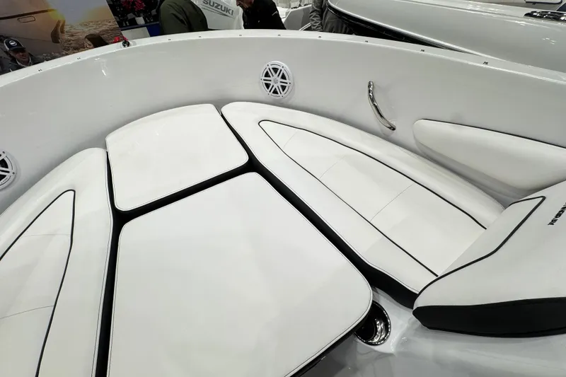 Slide: The Image of 2026 Stingray 172 DC boat interior with white cushioned seating and sleek design. - 21
