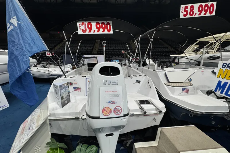 Slide: The Image of 2026 Stingray 172 DC boat displayed at a show, priced at $39,990. - 9