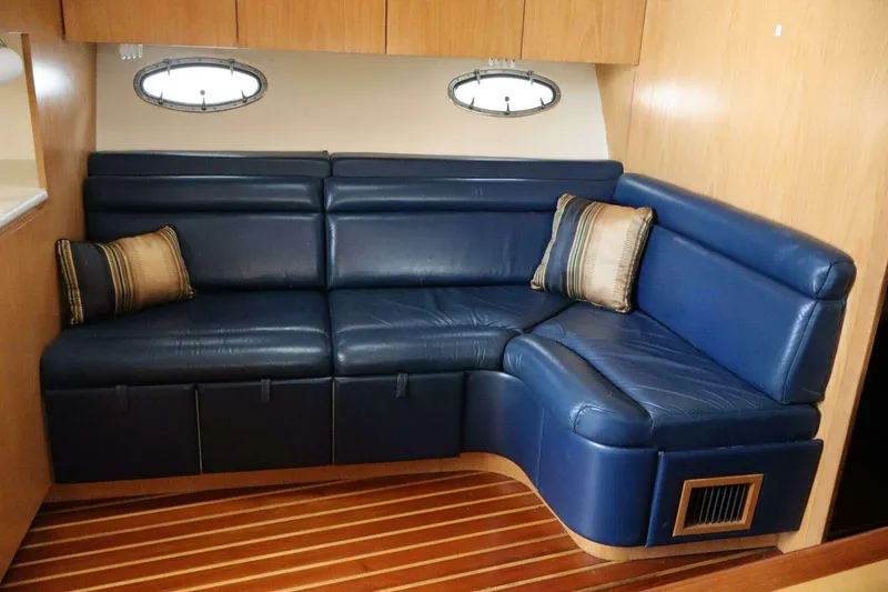 Slide: The Image of Luxurious blue leather seating in 2001 Tiara Yachts 4300 Open interior. - 14