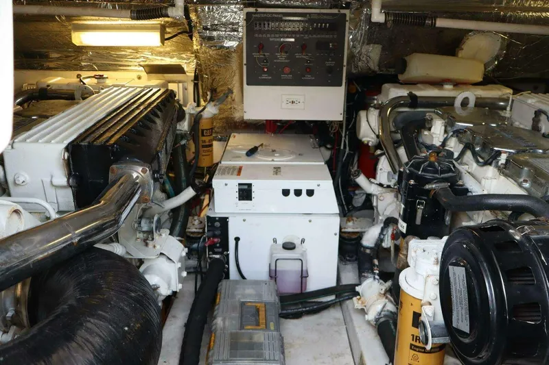 Slide: The Image of Engine room of 2001 Tiara Yachts 4300 Open, showcasing mechanical components and systems. - 19