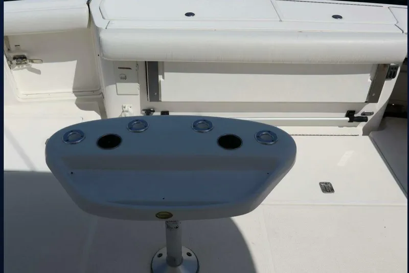 Slide: The Image of Cockpit area of 2001 Tiara Yachts 4300 Open, featuring rod holders and seating. - 8