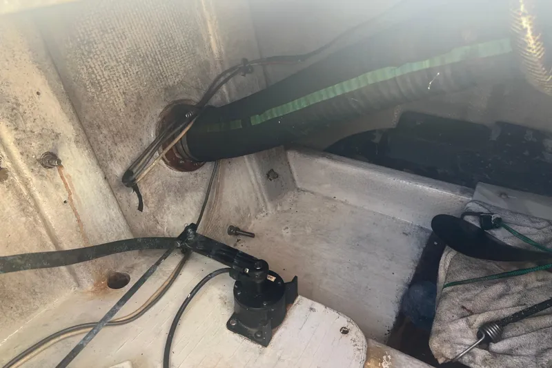 Slide: The Image of Interior view of a 1993 Nordic Tug 26 boat showing mechanical components. - 15