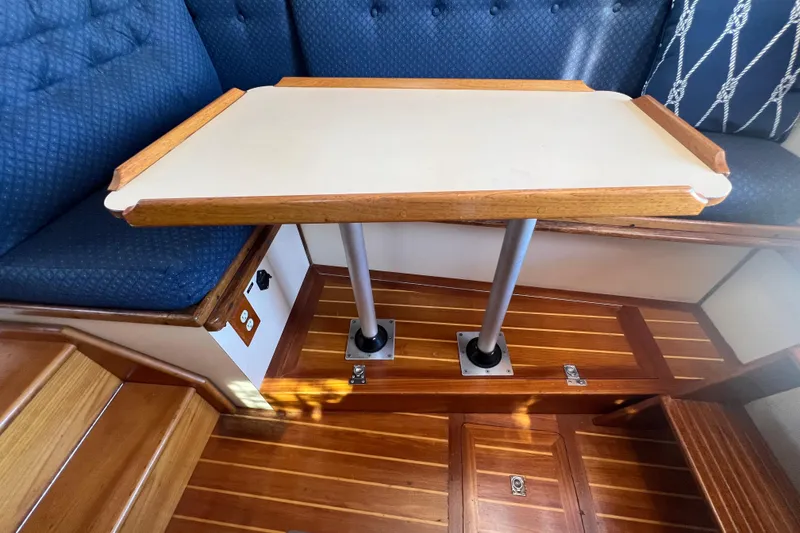 Slide: The Image of Compact kitchen in a 1993 Nordic Tug 26, featuring sink, microwave, and mini fridge. - 29