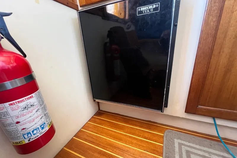 Slide: The Image of Furuno NAVnet display on 1993 Nordic Tug 26, showing nautical chart and radar settings. - 38