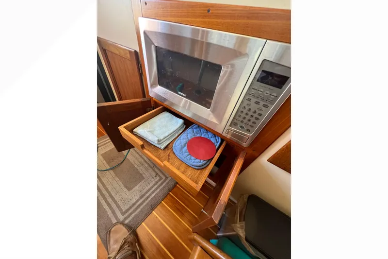 Slide: The Image of Navigation instruments on a 1993 Nordic Tug 26 boat dashboard, displaying depth and position. - 39