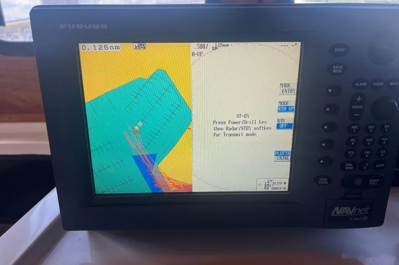 Slide: The Image of Control panel of a 1993 Nordic Tug 26 with various switches and labels. - 41