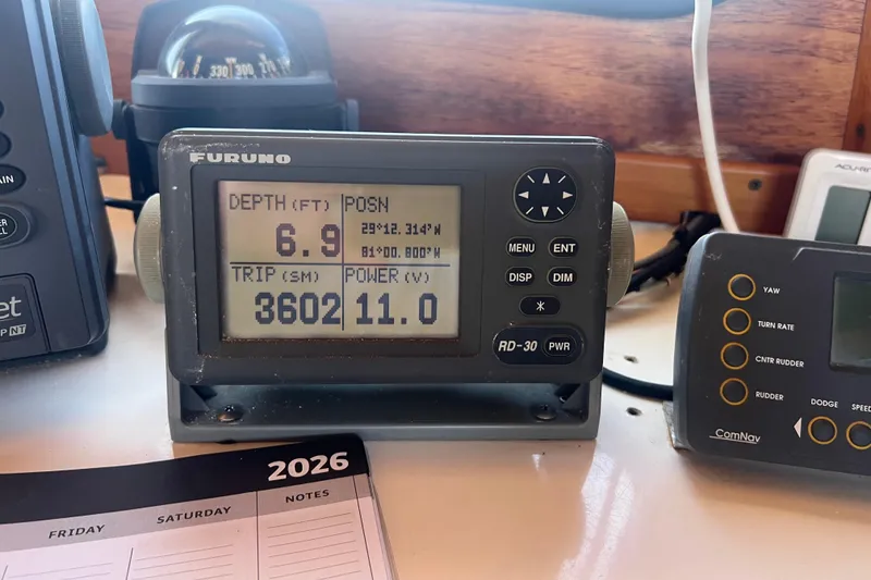 Slide: The Image of Yanmar engine control panel with gauges and switches on a 1993 Nordic Tug 26. - 42