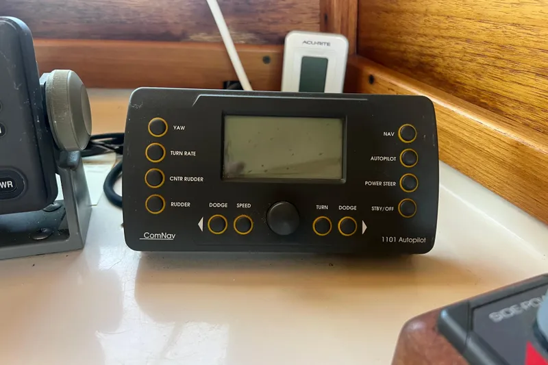 Slide: The Image of Joystick control panel on a 1993 Nordic Tug 26 boat dashboard. - 43