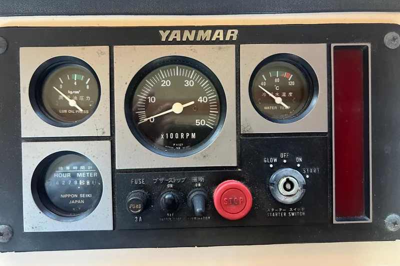 Slide: The Image of Control panel of a 1993 Nordic Tug 26, featuring radar and bilge pump switches. - 45