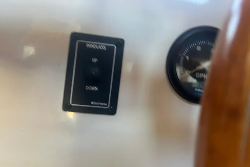 Slide: The Image of 1993 Nordic Tug 26 dashboard with windlass control and gauge. - 50