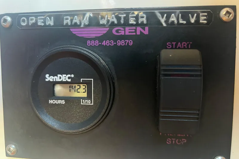 Slide: The Image of 1993 Nordic Tug 26 helm with wooden steering wheel and instrument panel. - 52