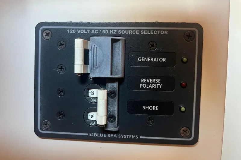 Slide: The Image of Battery switch panel on a 1993 Nordic Tug 26 boat, featuring Cole Hersee controls. - 54