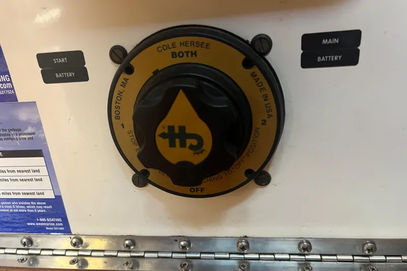 Slide: The Image of Interior of a 1993 Nordic Tug 26 with wooden finishes and nautical decor. - 57