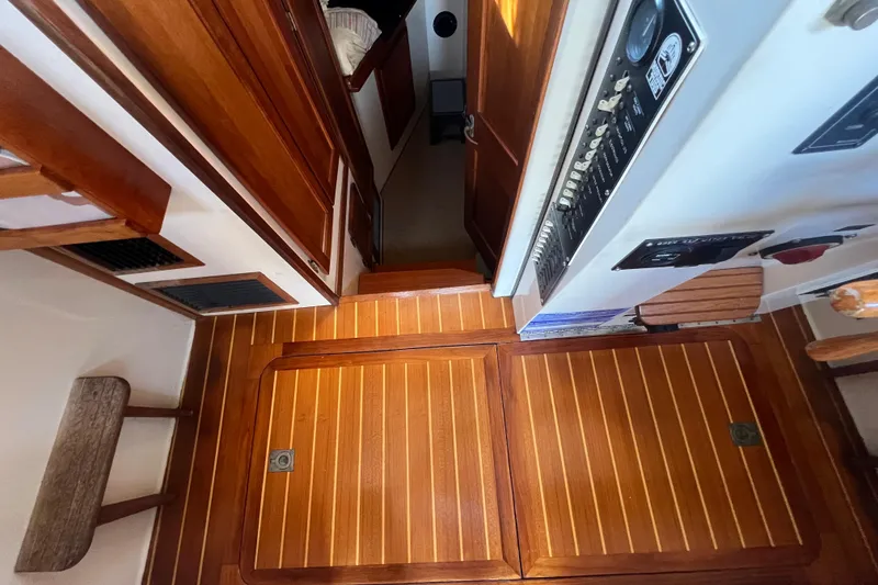 Slide: The Image of Cozy sleeping area in a 1993 Nordic Tug 26 boat with pillows and bedding. - 68