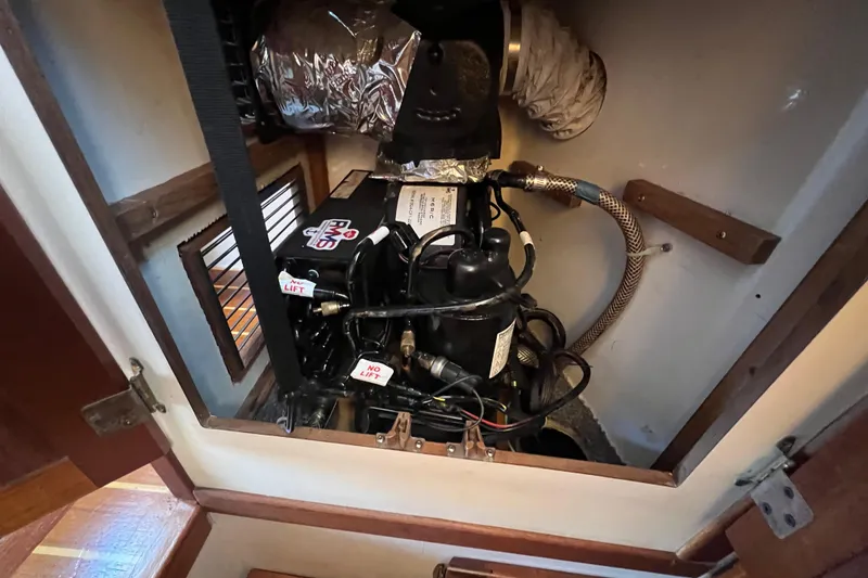 Slide: The Image of Cozy cabin interior of 1993 Nordic Tug 26 with porthole and ambient lighting. - 69