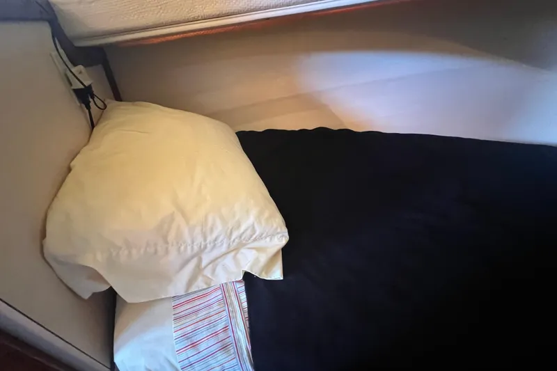 Slide: The Image of Interior of 1993 Nordic Tug 26 with ceiling light and dreamcatcher decoration. - 72