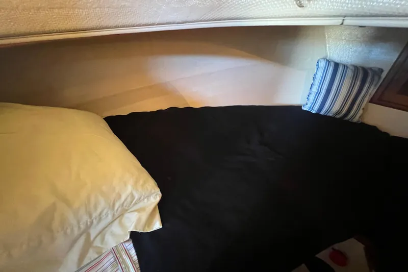 Slide: The Image of Interior ceiling of a 1993 Nordic Tug 26 boat with porthole and lighting. - 73