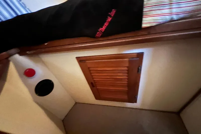 Slide: The Image of Interior of 1993 Nordic Tug 26, featuring wooden door and steps, natural light. - 75