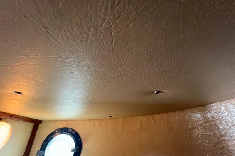 Slide: The Image of 1993 Nordic Tug 26 boat interior sink with faucet and countertop. - 78