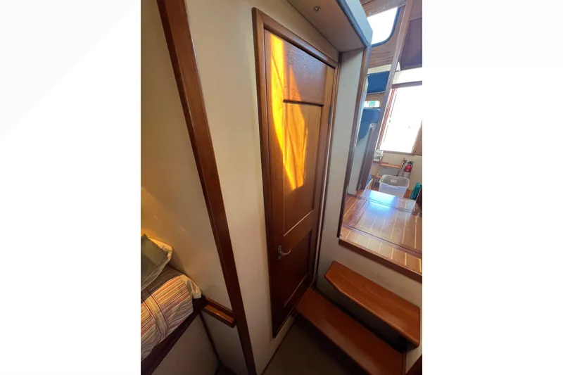 Slide: The Image of Interior of 1993 Nordic Tug 26 with wooden hooks and paneling. - 80