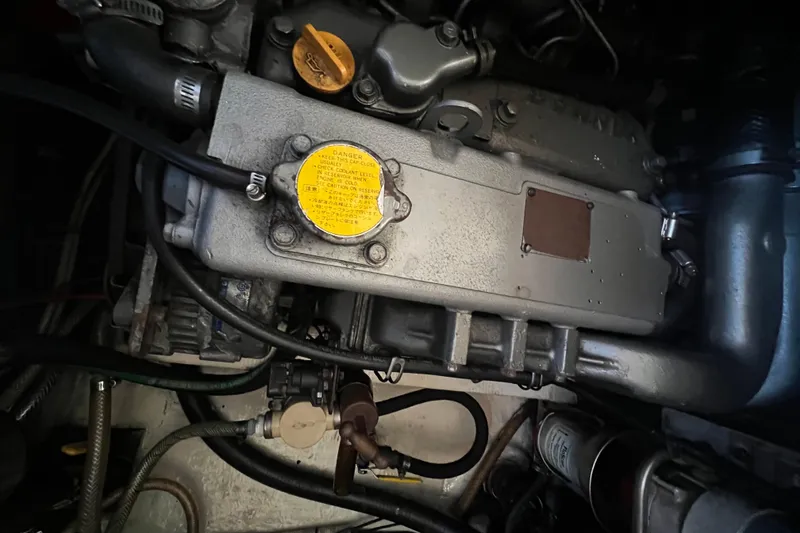 Slide: The Image of Engine compartment of a 1993 Nordic Tug 26, showcasing detailed mechanical components. - 90