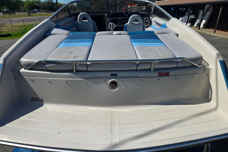 Slide: The Image of 1987 Sea Ray Pachanga 22 boat interior with blue and gray seating, steering wheel visible. - 16