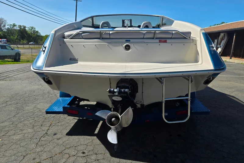 Slide: The Image of 1987 Sea Ray Pachanga 22 boat on trailer, rear view showing propeller and ladder. - 17