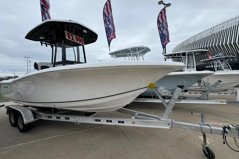 The Image of 2026 Tidewater 220 LXF boat on trailer, priced at $82,990, displayed outdoors. - 1