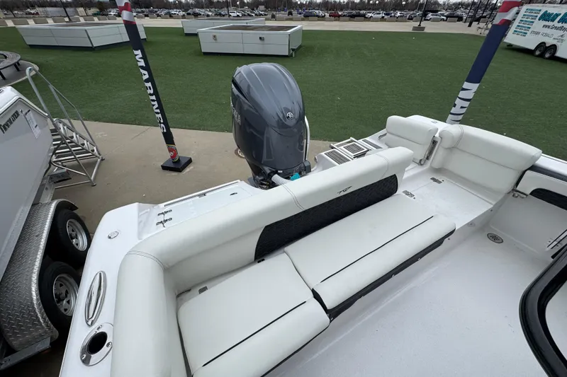 Slide: The Image of 2026 Tidewater 220 LXF boat interior with seating and outboard motor. - 20