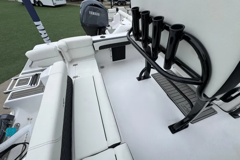 Slide: The Image of 2026 Tidewater 220 LXF boat interior with Yamaha engine and rod holders. - 21