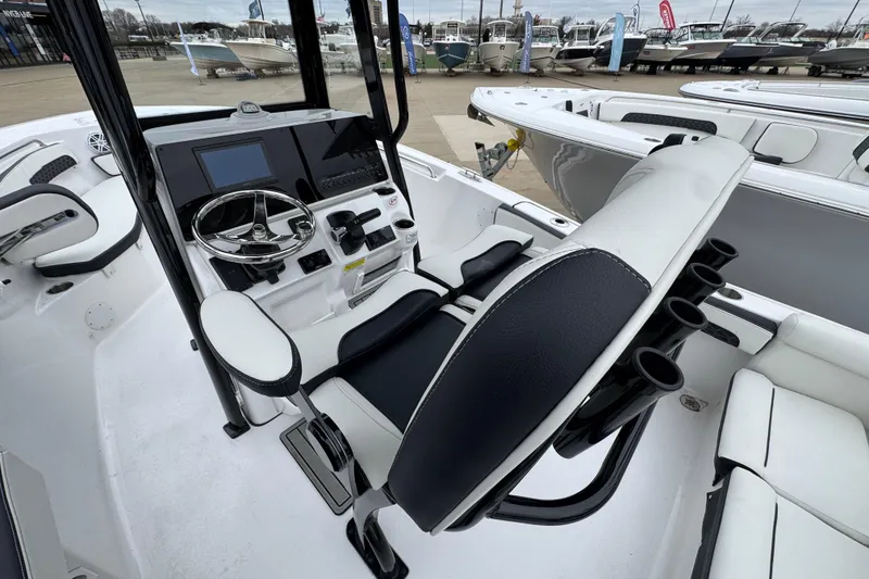 Slide: The Image of 2026 Tidewater 220 LXF boat interior with steering console and seating. - 6