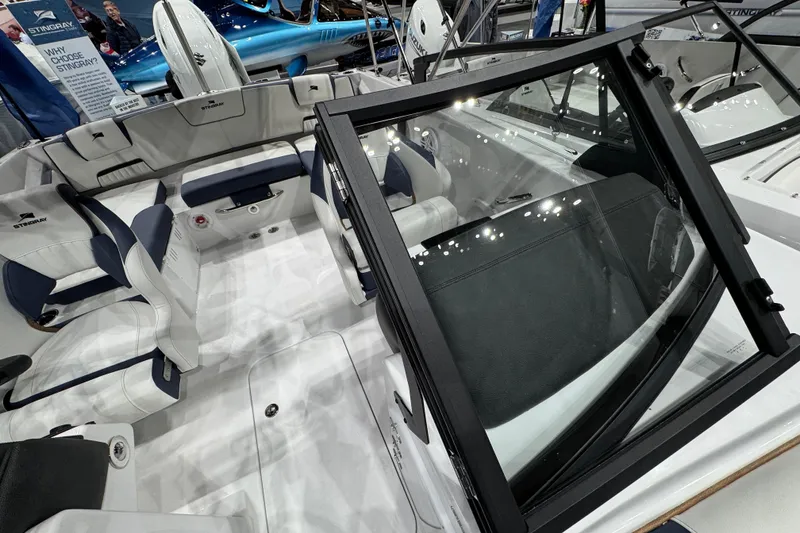Slide: The Image of 2026 Stingray 20 SBX boat interior with white and navy seating, showcasing modern design. - 19