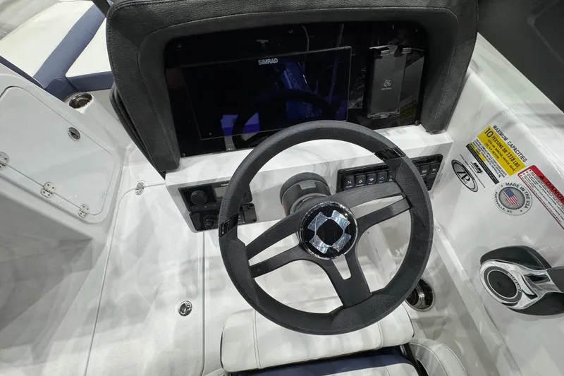 Slide: The Image of 2026 Stingray 20 SBX boat dashboard with steering wheel and control panel. - 4