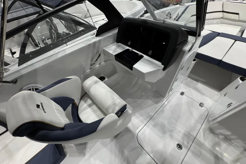 Slide: The Image of 2026 Stingray 20 SBX boat interior with sleek seating and modern dashboard design. - 5
