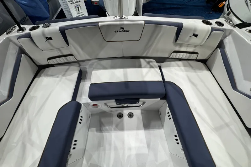 Slide: The Image of 2026 Stingray 20 SBX boat interior with white and navy seating, showcasing modern design. - 7