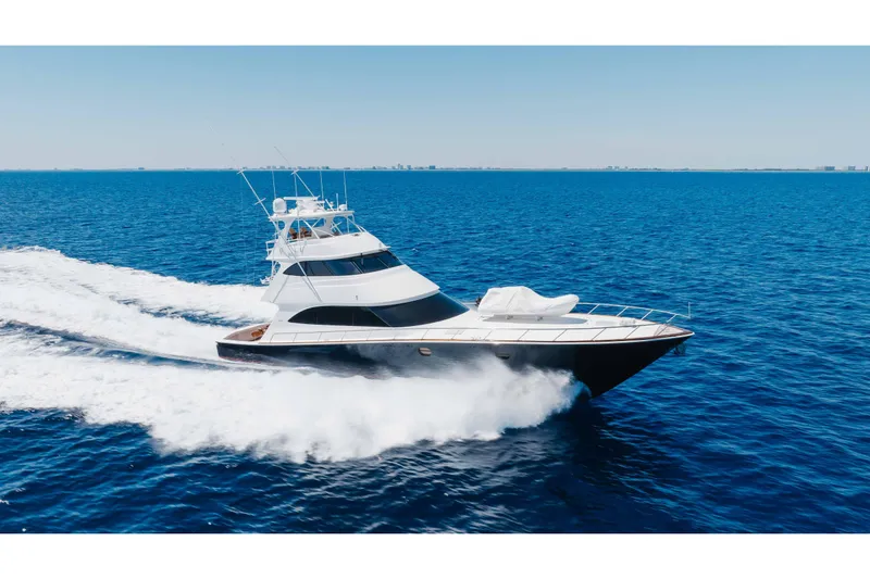 The Image of 2016 Viking 82 Sky Bridge yacht cruising on open blue sea. - 1