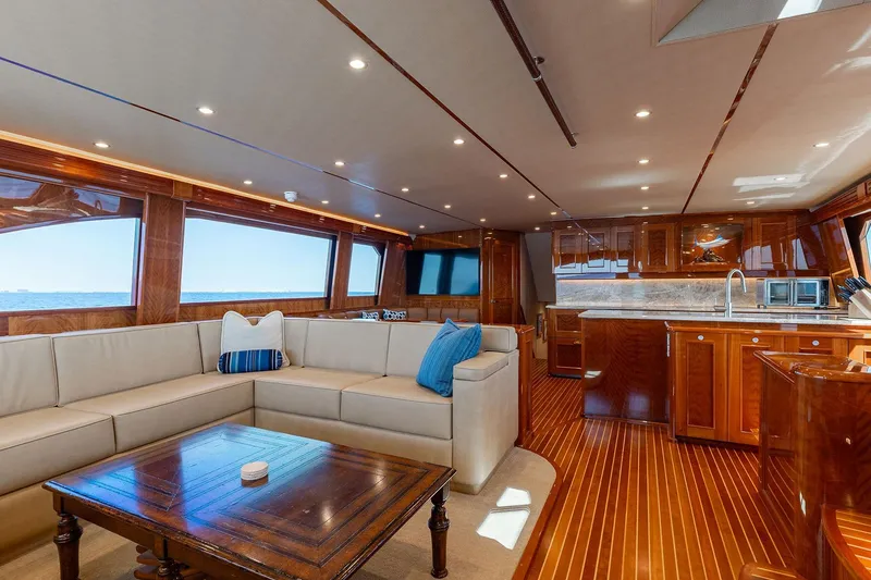 Slide: The Image of Luxurious interior of 2016 Viking 82 Sky Bridge yacht with elegant wood finishes and spacious seating. - 17