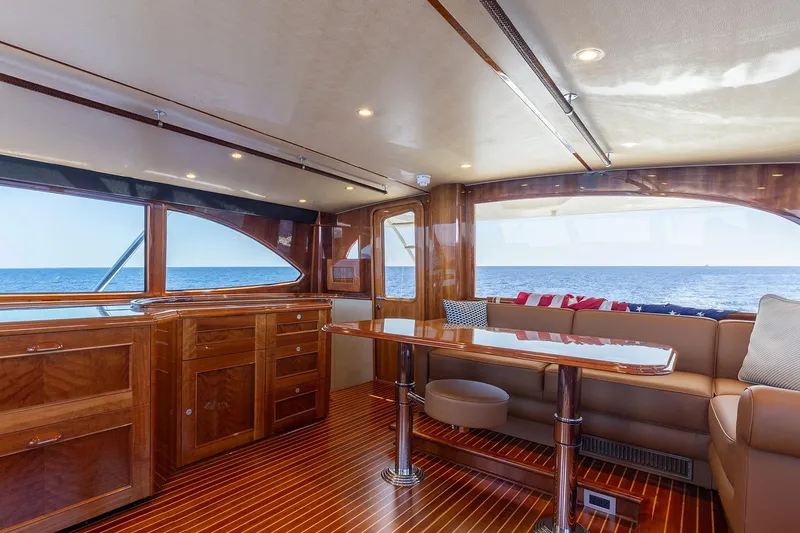 Slide: The Image of Luxurious interior of 2016 Viking 82 Sky Bridge yacht with ocean view and elegant wood finishes. - 29
